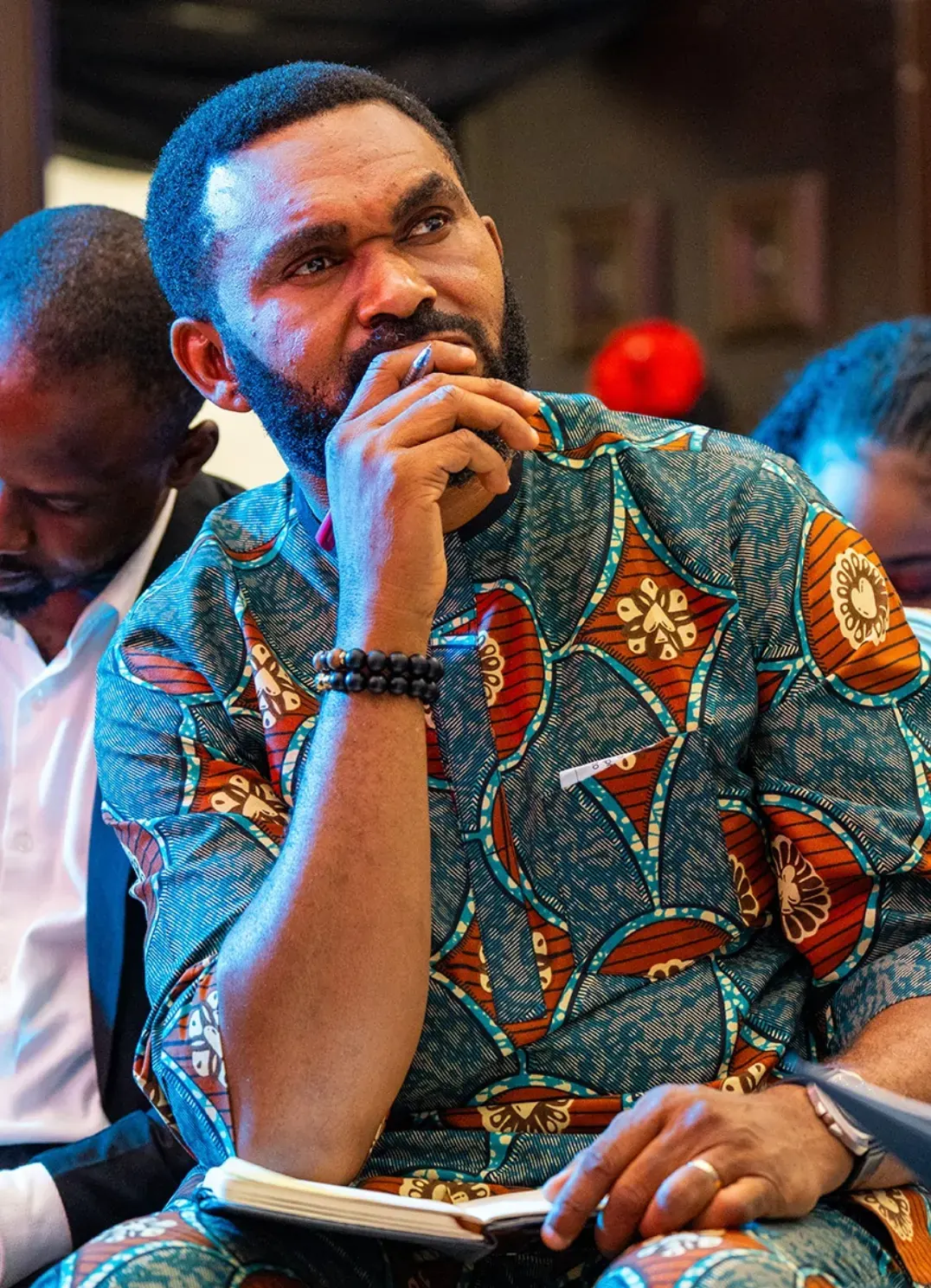 Student taking notes during lecture